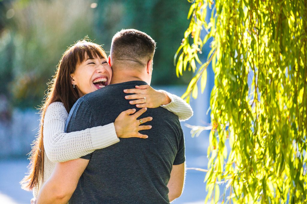 engagement portrait of a couple laughing together