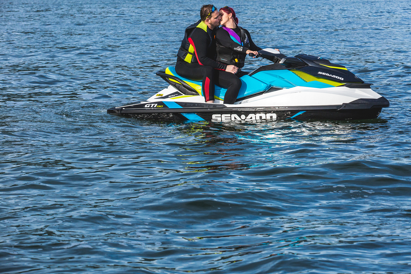 a couple jet skis around the Vancouver howe sound for their offbeat engagement session
