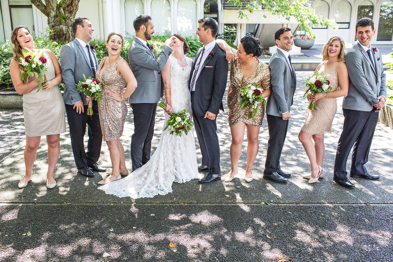 Bridal party laughing together at Vanier Park in Vancouver