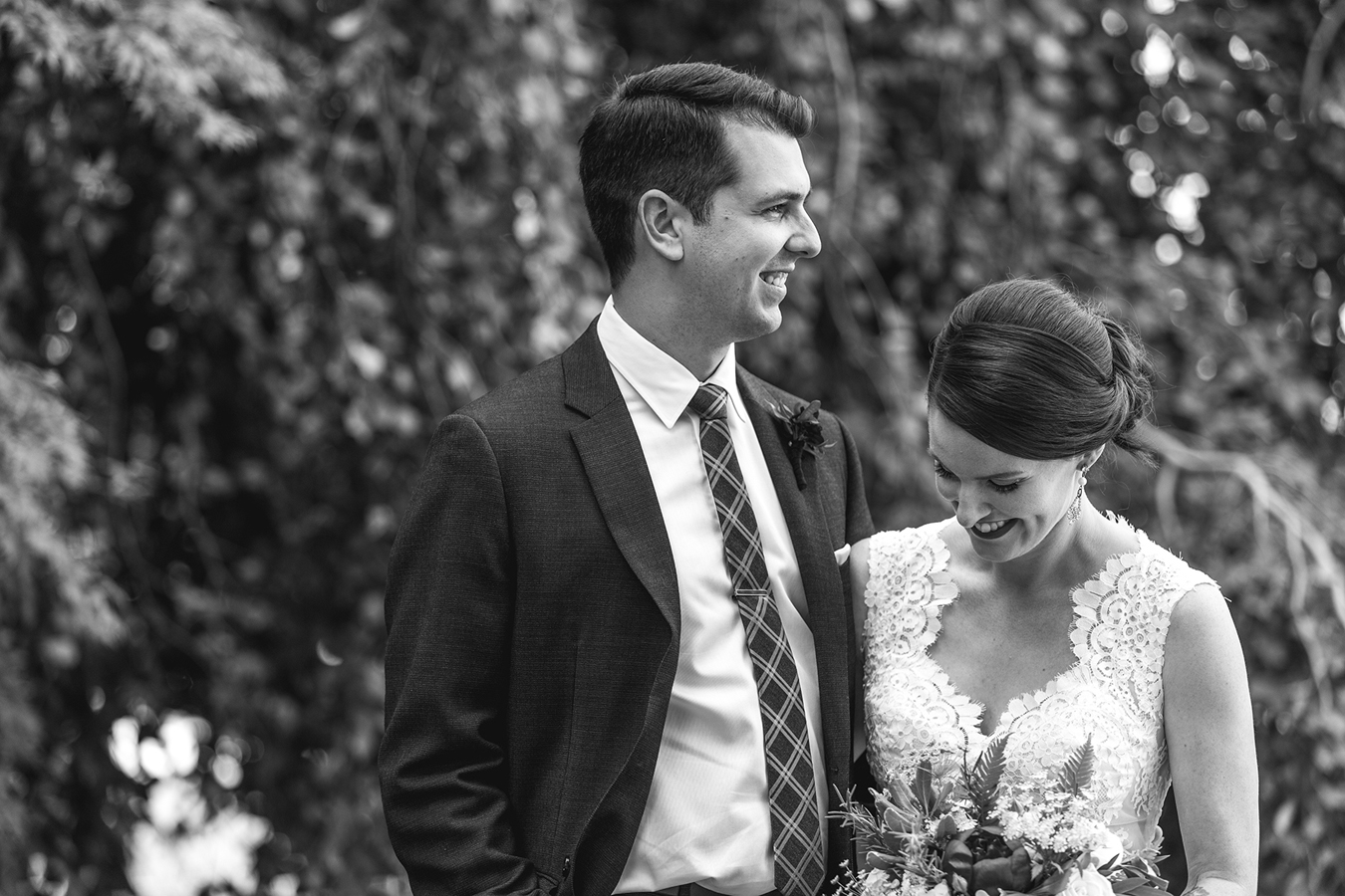 candid portrait of bride and groom laughing together at Vanier Park in Vancouver