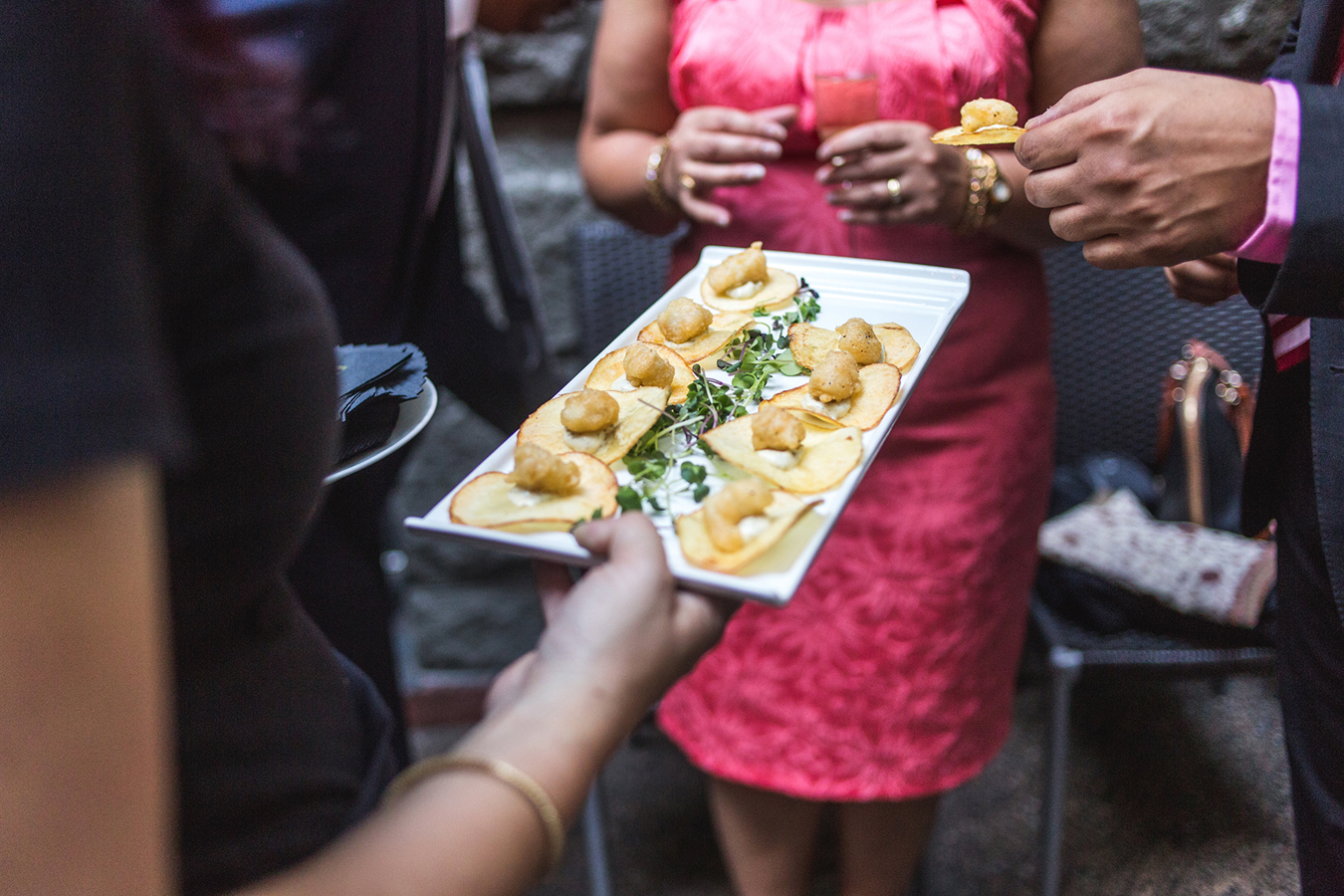 Fish and chip appetizers are handed out during the cocktail hour at a wedding in Yaletown