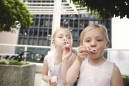 flowergirls blowing bubbles at a wedding