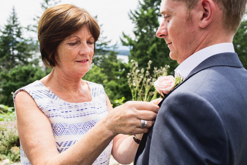 Mom pinning on the boutonniere