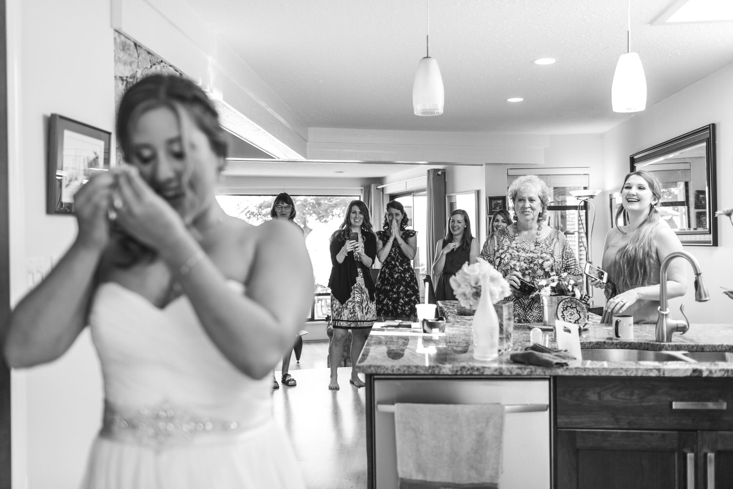 emotional bride cries as her friends see her for the first time
