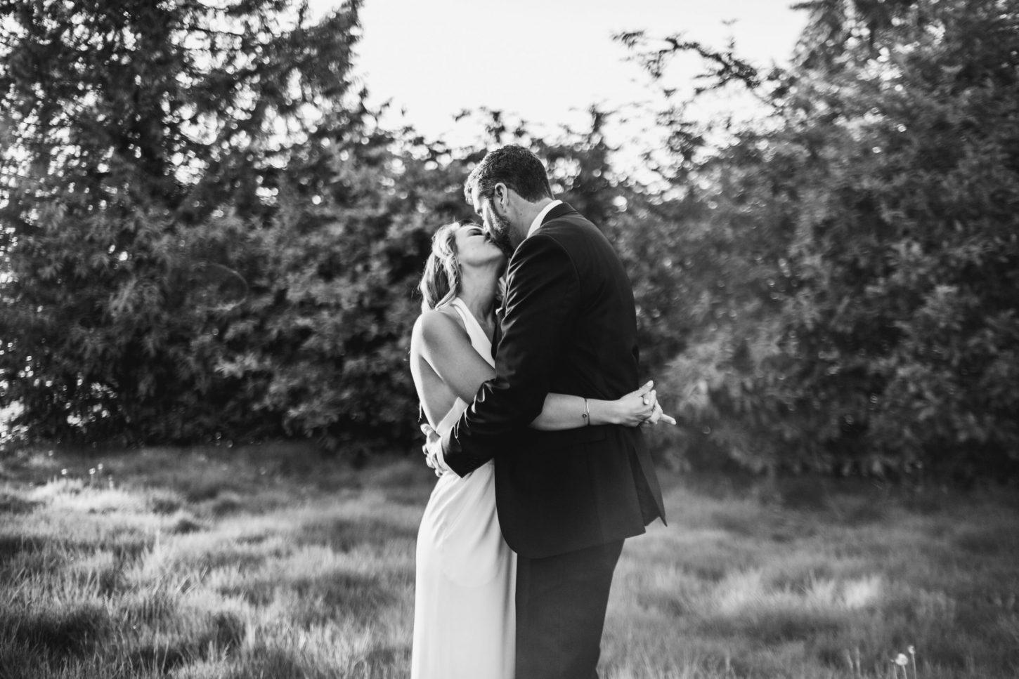 bride and groom kiss at an intimate backyard wedding in coquitlam